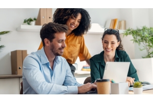 Three co-workers working together on a project